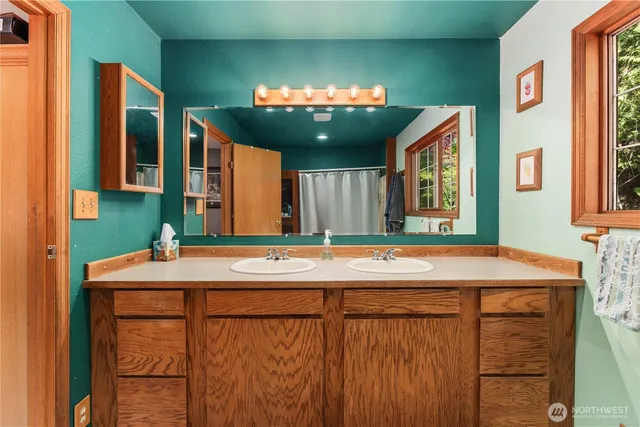 an aerial view of a house with swimming pool and sitting area