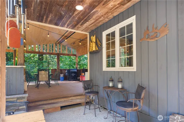 a view of a patio with table and chairs and potted plants