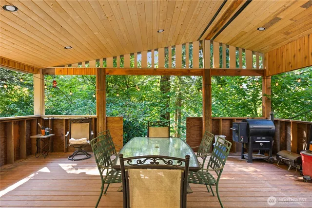 a view of a chairs and table in the patio