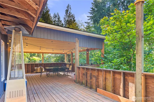 a view of a wooden deck with a yard