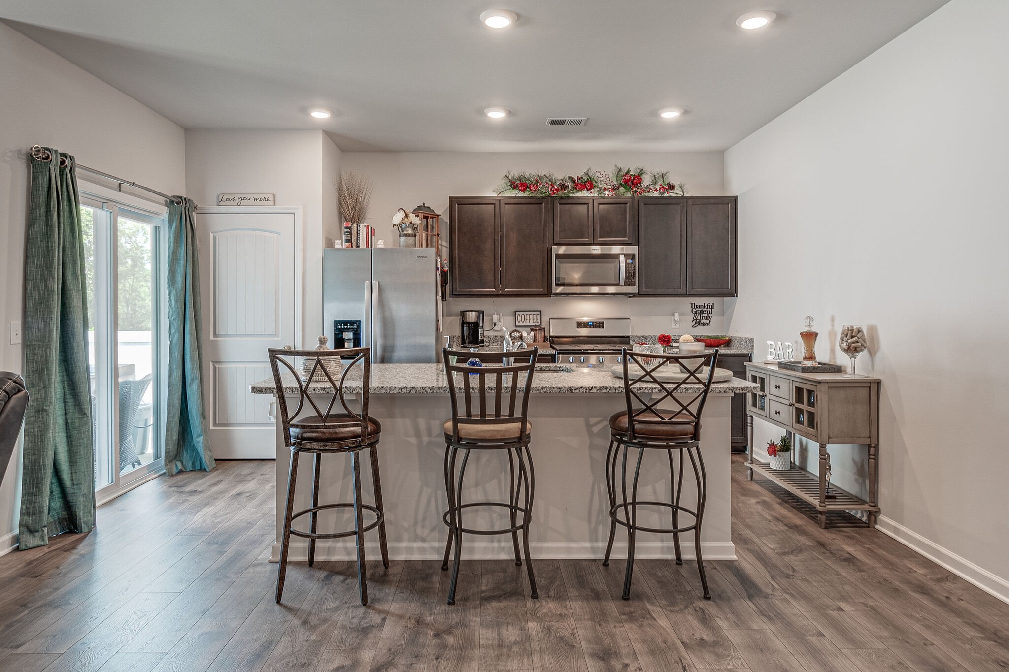 1122 Woodbridge Boulevard Lebanon, TN 37090 - Photo 14 of 30 a view of kitchen with kitchen island dining table and stainless steel appliances