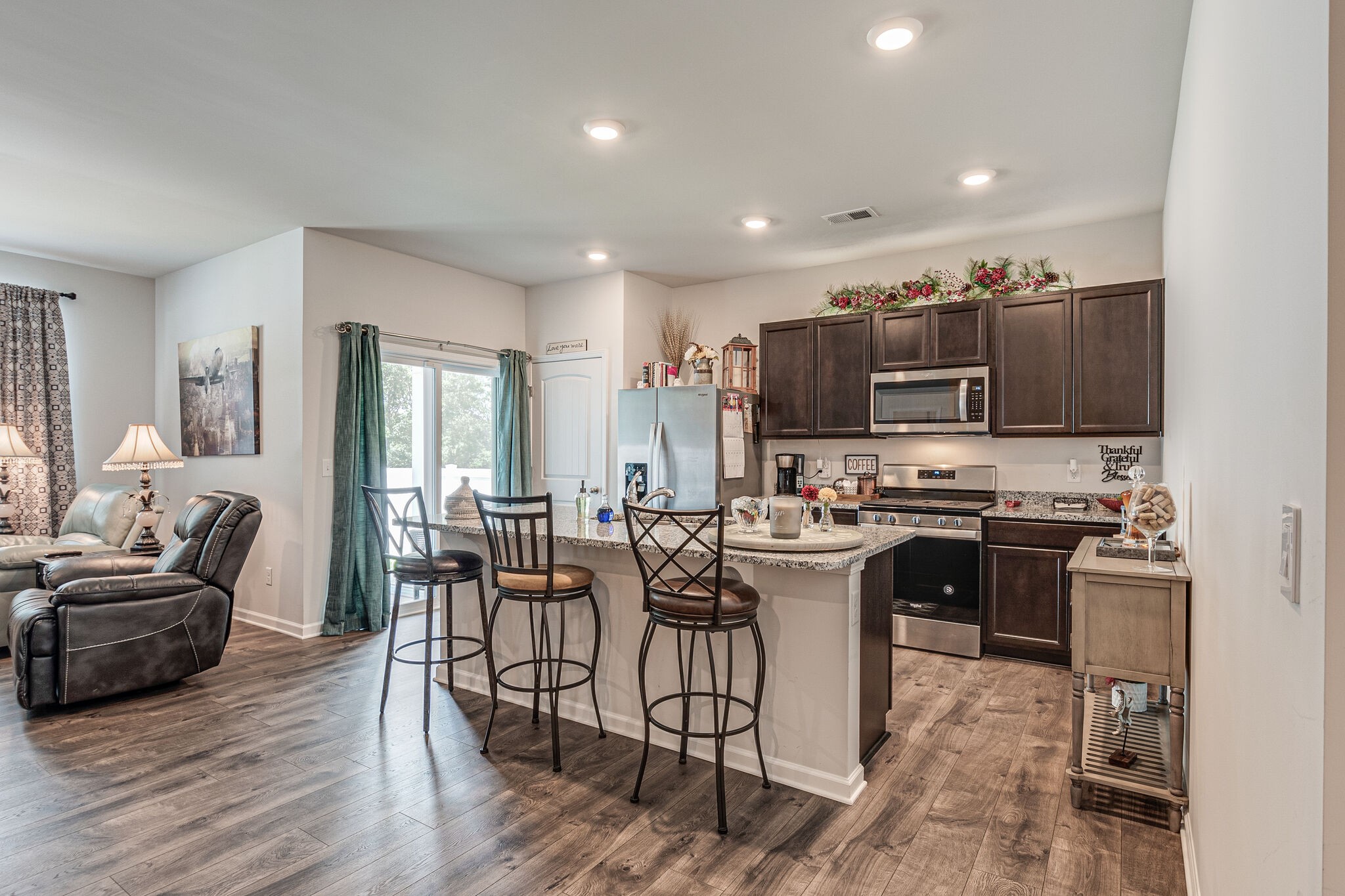 1122 Woodbridge Boulevard Lebanon, TN 37090 - Photo 15 of 30 a view of a dining room kitchen with furniture and wooden floor