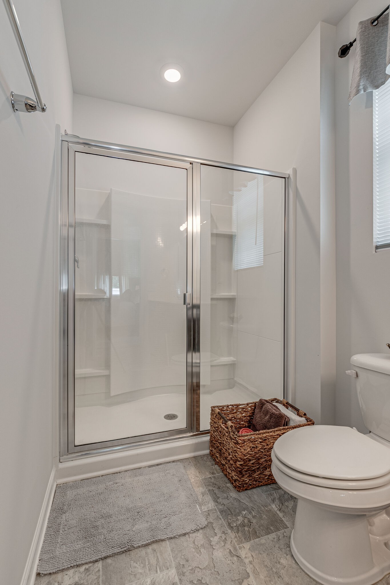 1122 Woodbridge Boulevard Lebanon, TN 37090 - Photo 21 of 30 a bathroom with a toilet and a shower