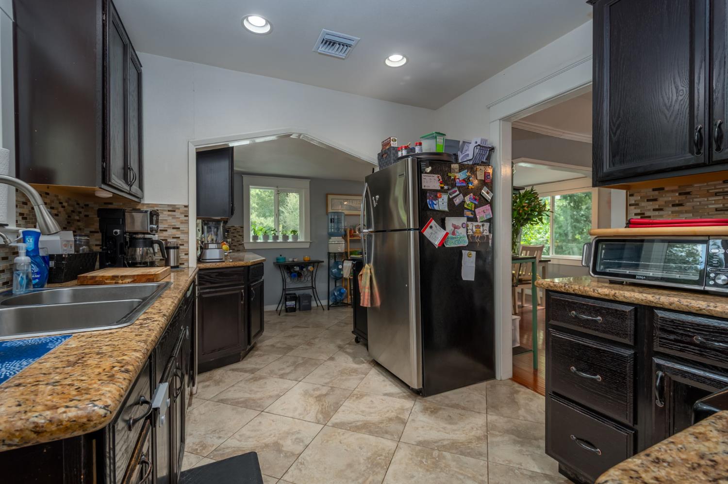 15663 Ojai Road Santa Paula, CA 93060 - Photo 10 of 47 a kitchen with refrigerator and window