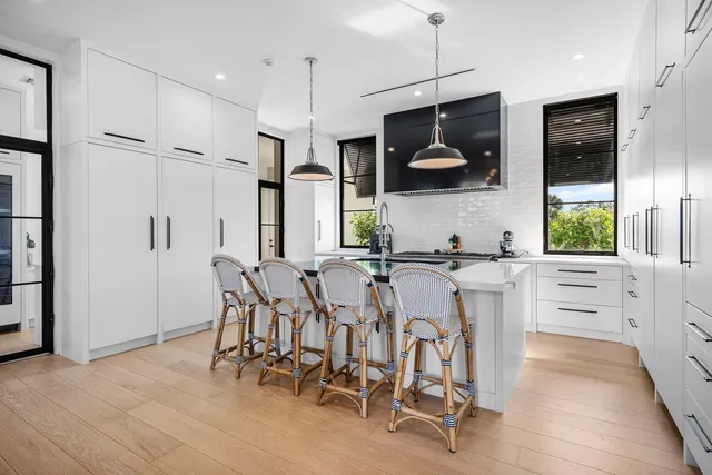 a kitchen with stainless steel appliances granite countertop a stove and a sink