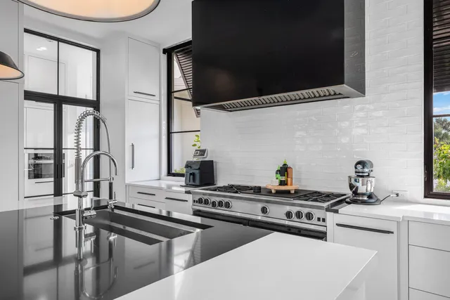 a dinning room and kitchen with a large window