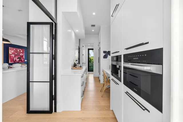 a view of storage and utility room with racks on the wall