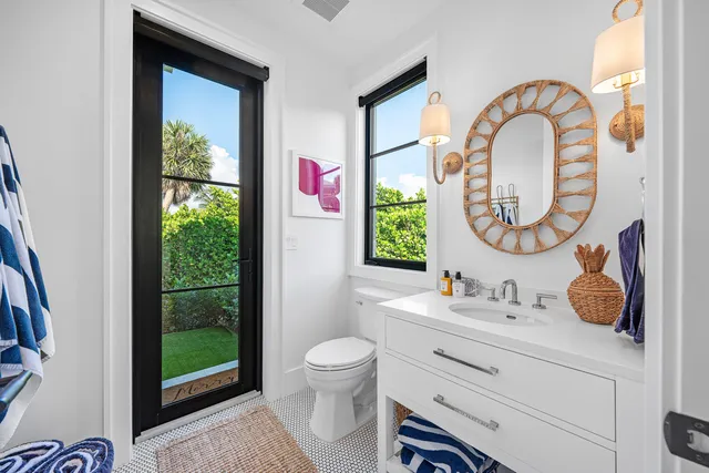 a bed sitting in a spacious bedroom next to a window