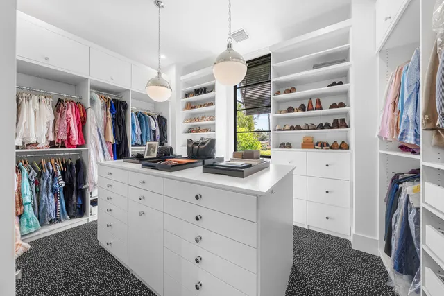 a bedroom with a large bed and a large window