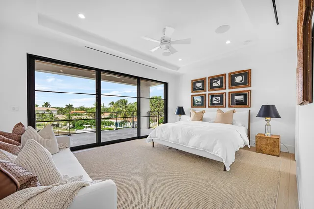 a bathroom with a granite countertop toilet sink and mirror