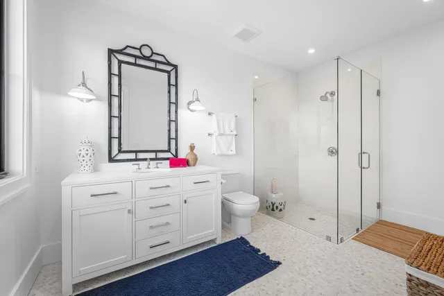 a living room with fireplace furniture and a large window