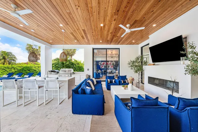 a front view of house with yard outdoor seating and barbeque oven