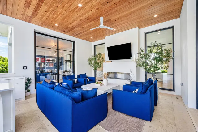a view of an house with backyard space and balcony
