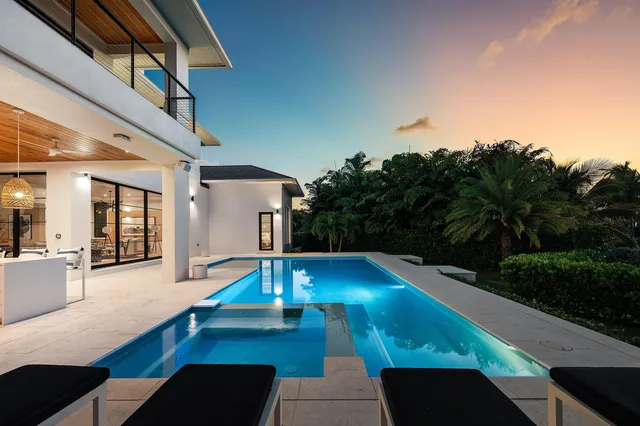 a living room with fireplace furniture and a flat screen tv