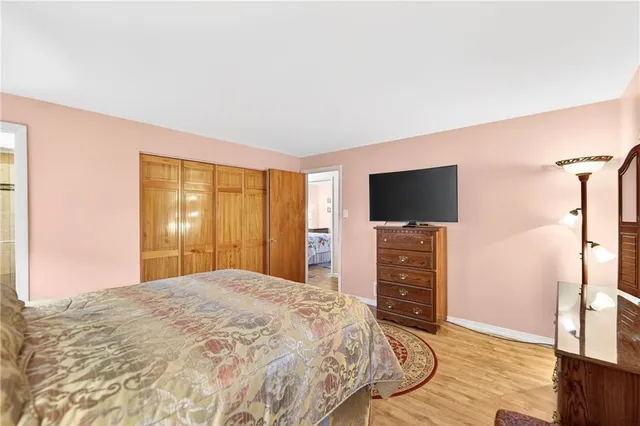 a bathroom with a shower a sink and a mirror