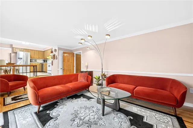 a blue room with furniture and a rug