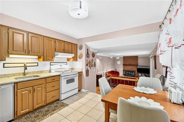 a kitchen with stainless steel appliances granite countertop a sink and cabinets