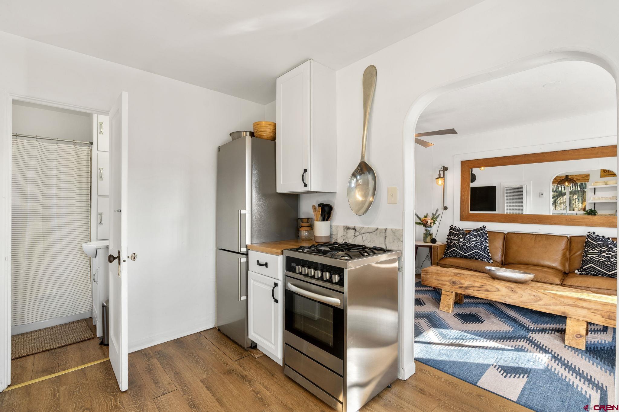 2 Carol Drive Durango, CO 81301 - Photo 18 of 41 a kitchen with stainless steel appliances granite countertop a stove a sink and a refrigerator
