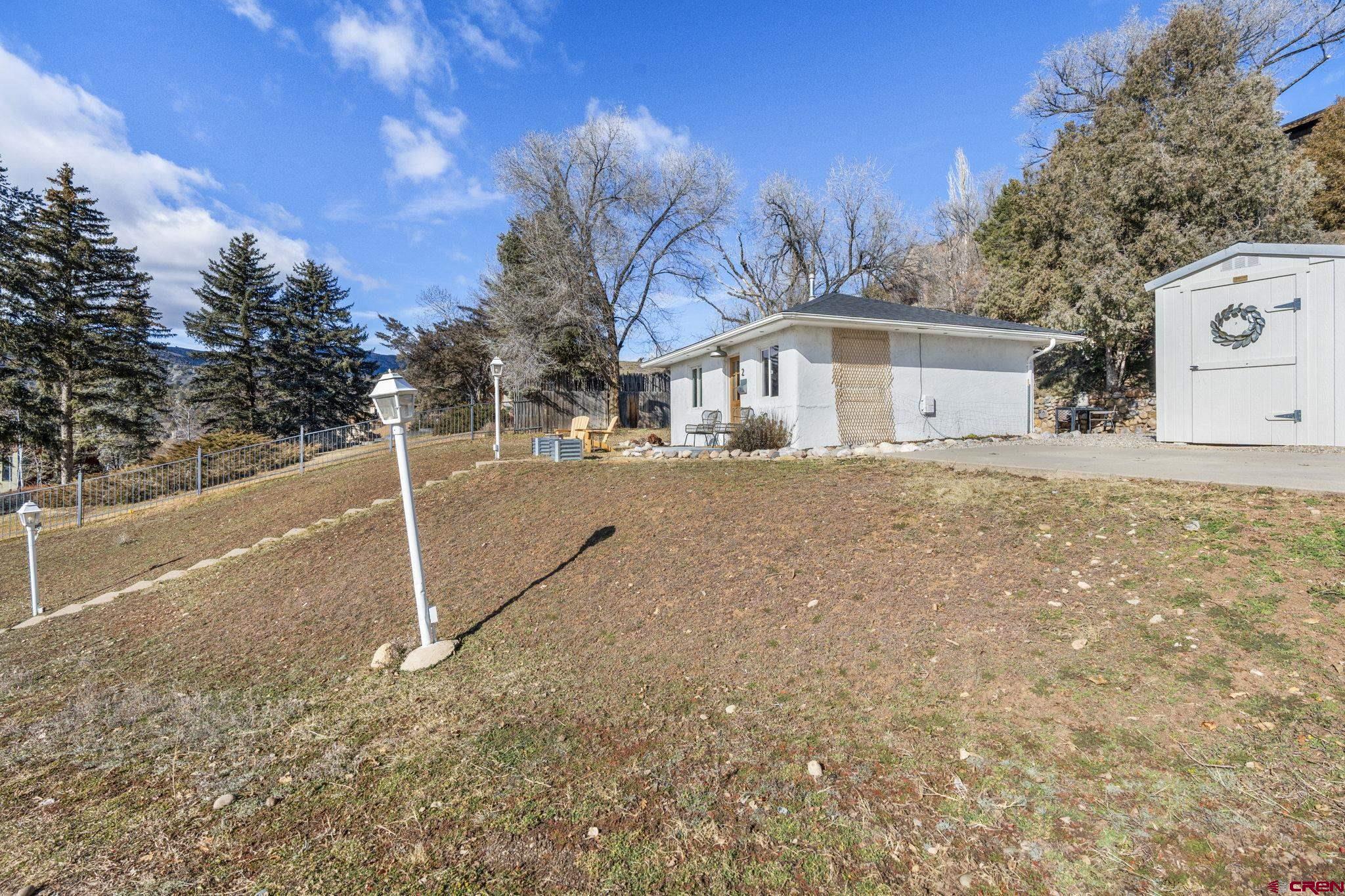 2 Carol Drive Durango, CO 81301 - Photo 28 of 41 a front view of a house with a yard