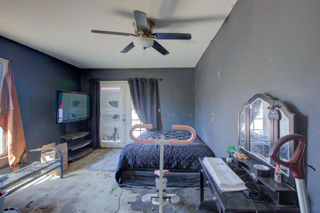 a white toilet sitting next to a bathroom sink