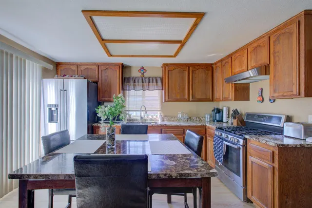 a kitchen with granite countertop lots of counter top space