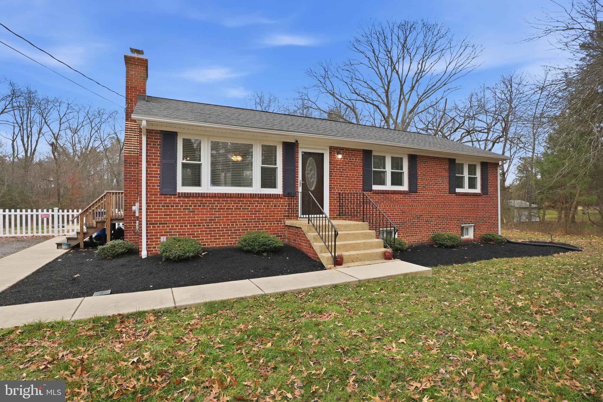16402 Baden Naylor Road Brandywine, MD 20613 - Photo 1 of 37 a front view of a house with garden