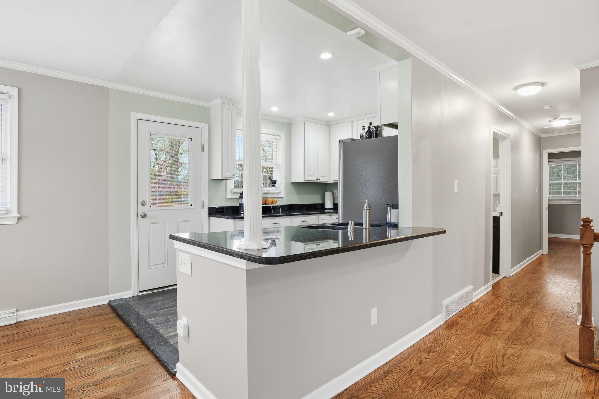 16402 Baden Naylor Road Brandywine, MD 20613 - Photo 11 of 37 a kitchen with stainless steel appliances granite countertop a sink and refrigerator