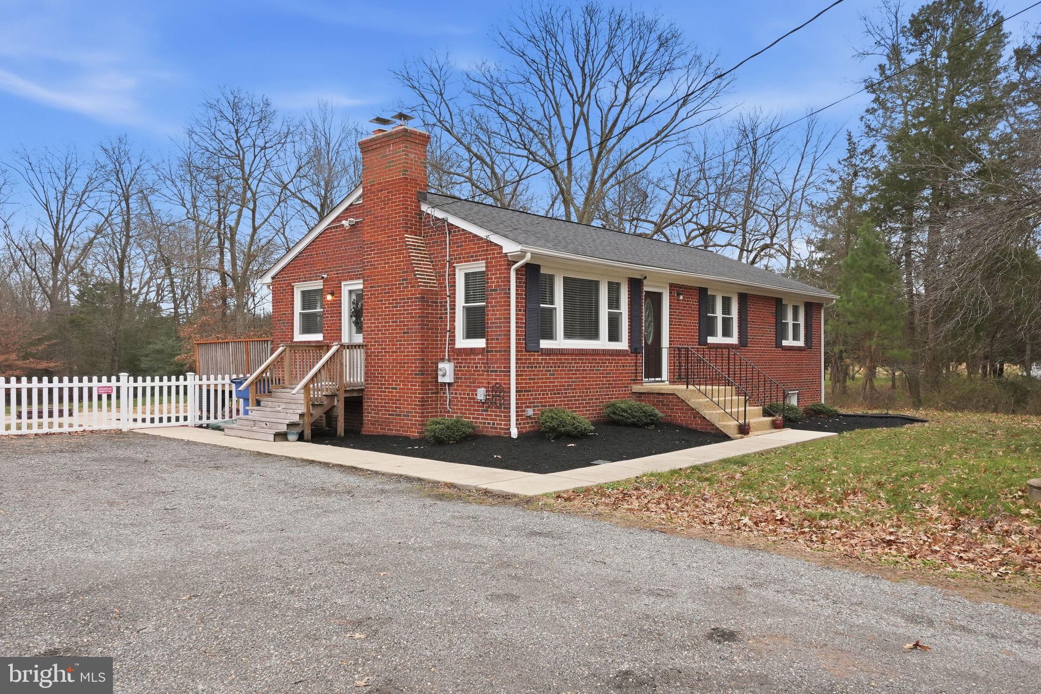 16402 Baden Naylor Road Brandywine, MD 20613 - Photo 2 of 37 a front view of a house with a yard and garage