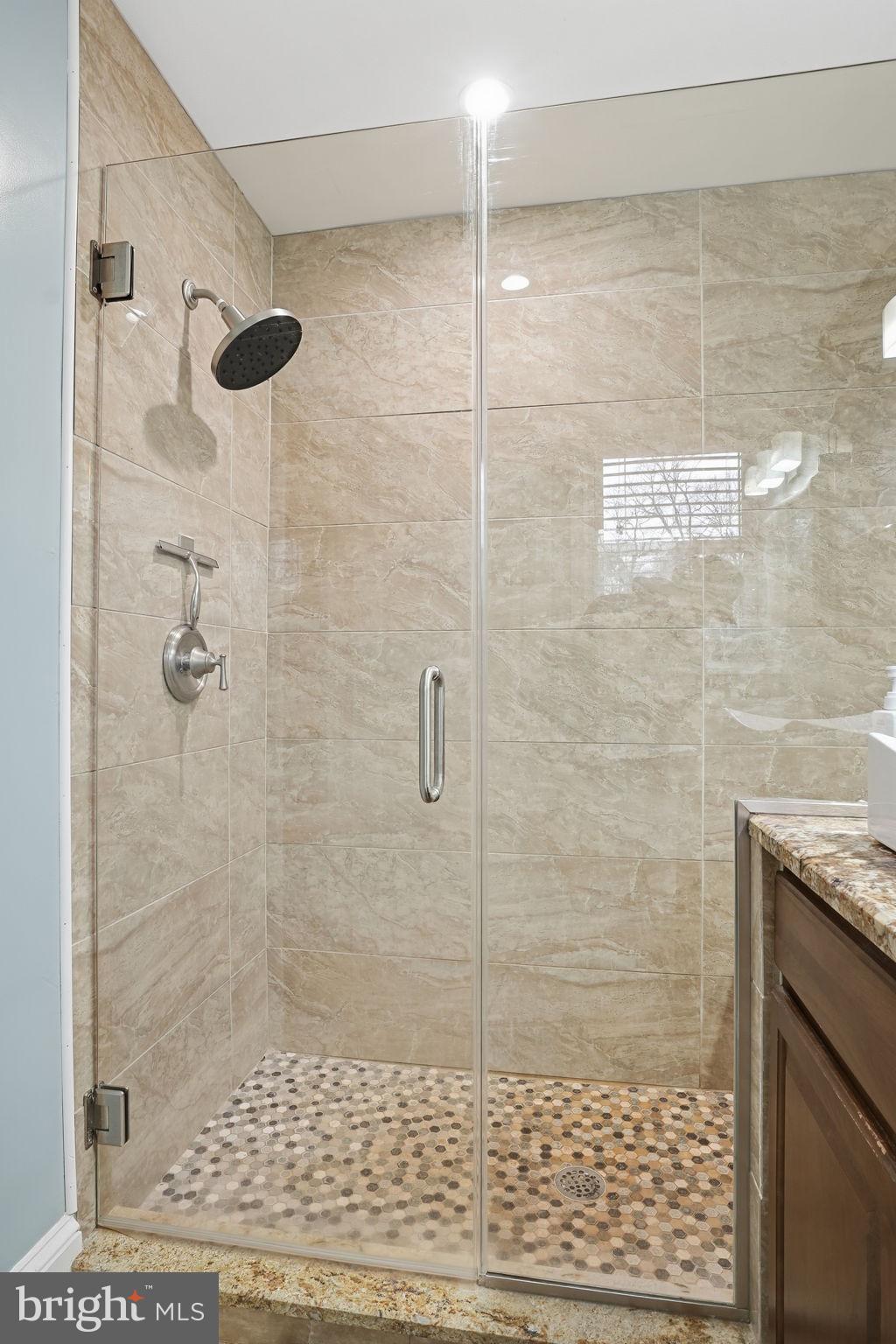 16402 Baden Naylor Road Brandywine, MD 20613 - Photo 21 of 37 a bathroom with a shower