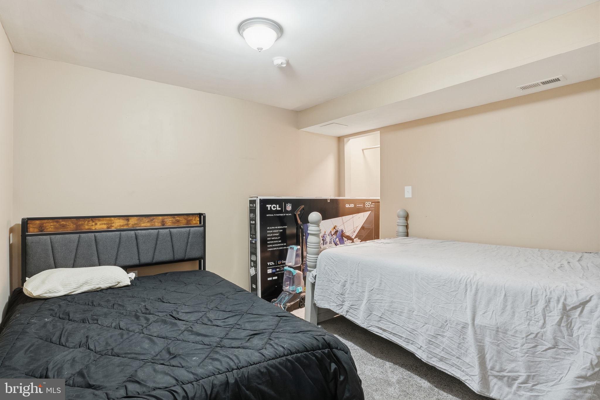 16402 Baden Naylor Road Brandywine, MD 20613 - Photo 28 of 37 a bedroom with a bed and a chair