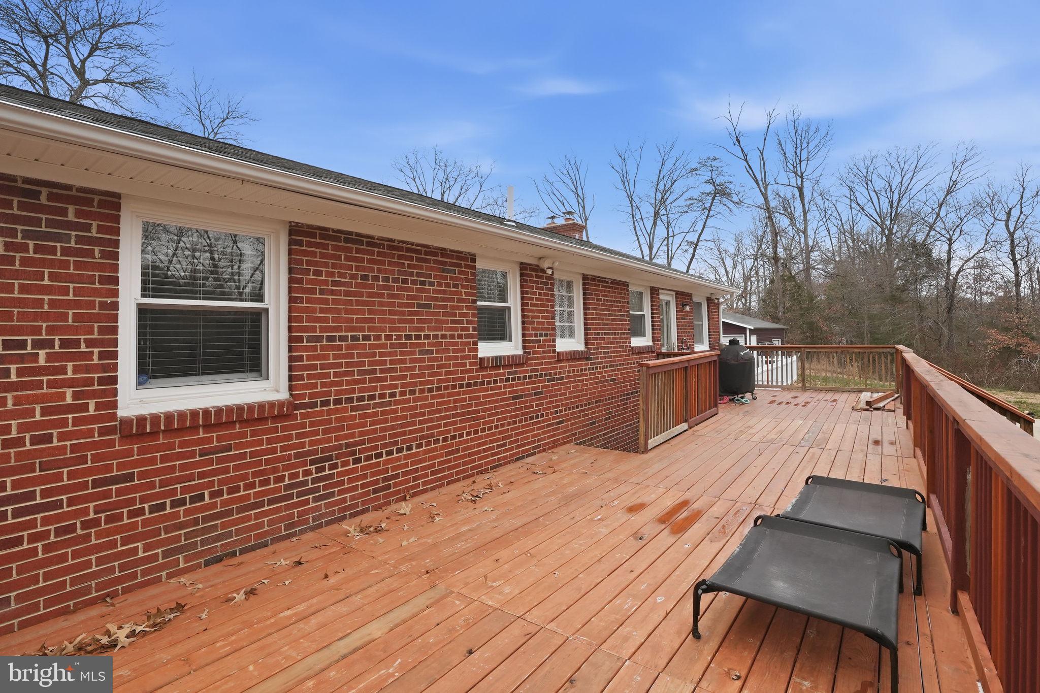 16402 Baden Naylor Road Brandywine, MD 20613 - Photo 32 of 37 a view of backyard with deck and wooden floor