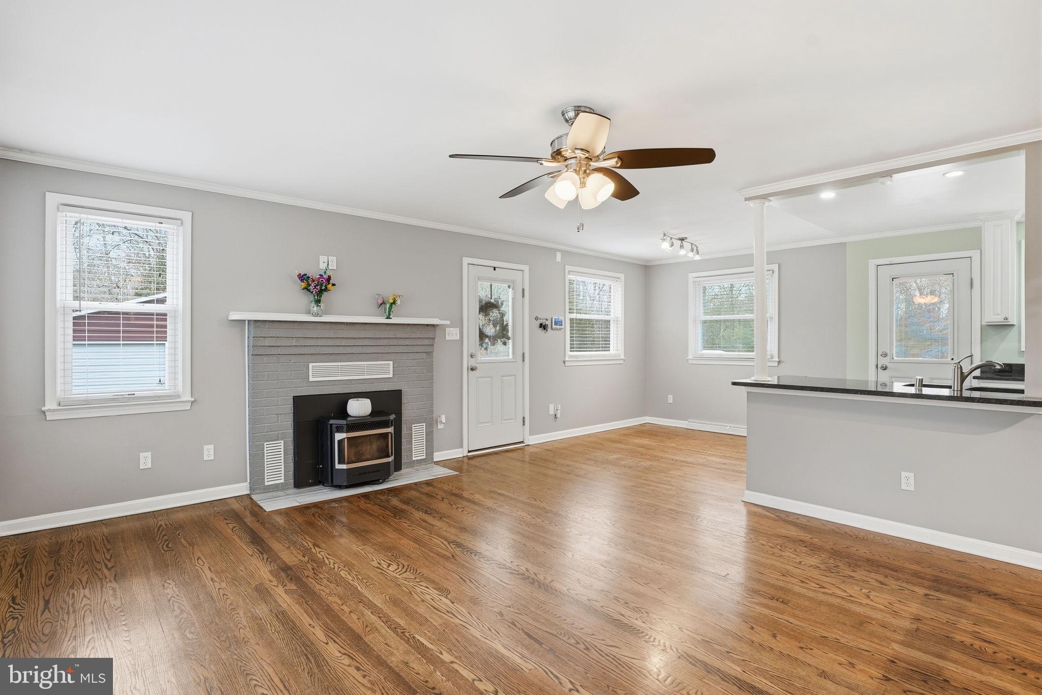 16402 Baden Naylor Road Brandywine, MD 20613 - Photo 9 of 37 a view of empty room with wooden floor and fireplace