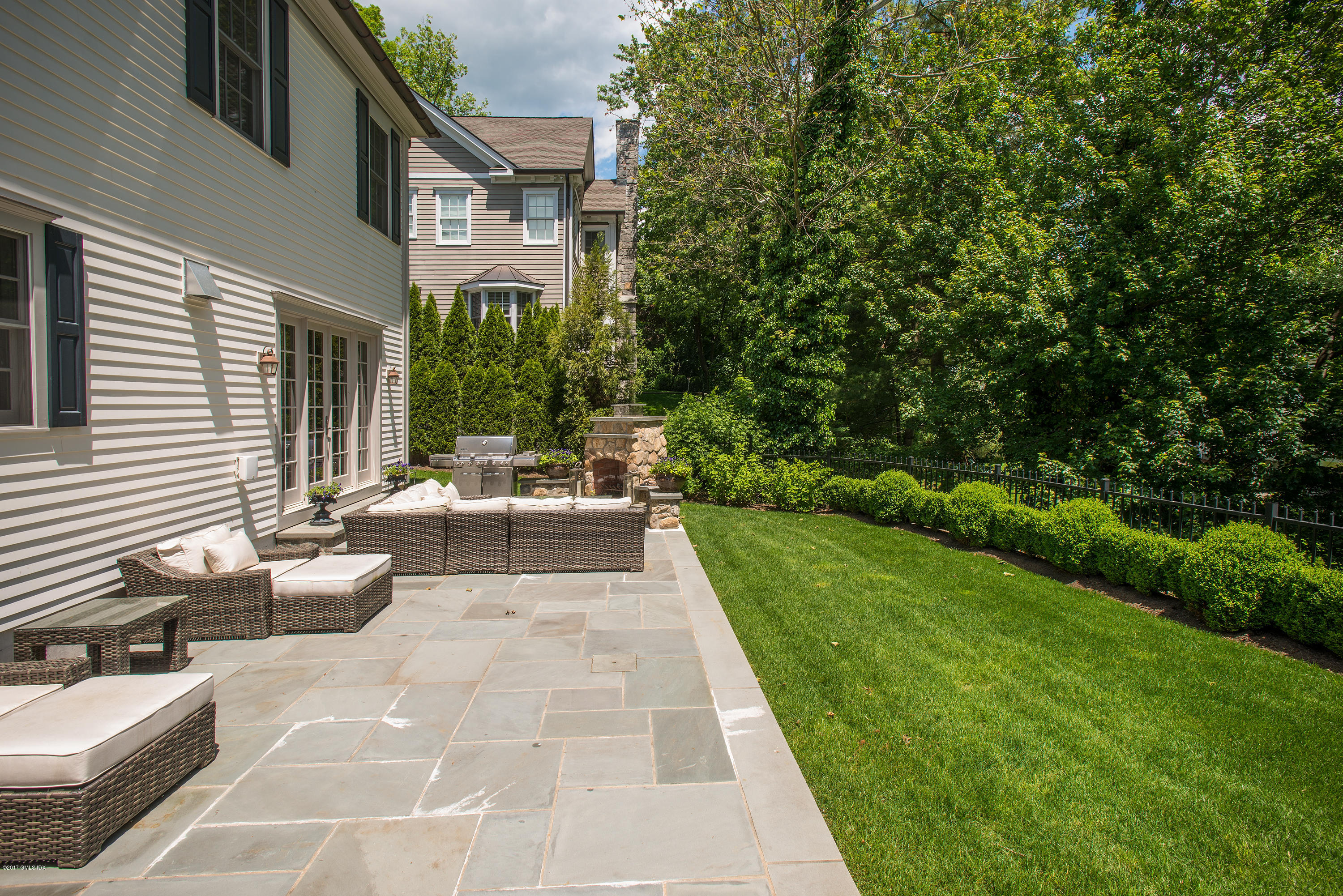 99 Overlook Drive Greenwich, CT 06830 - Photo 16 of 20 a view of a patio with couches table and chairs and potted plants