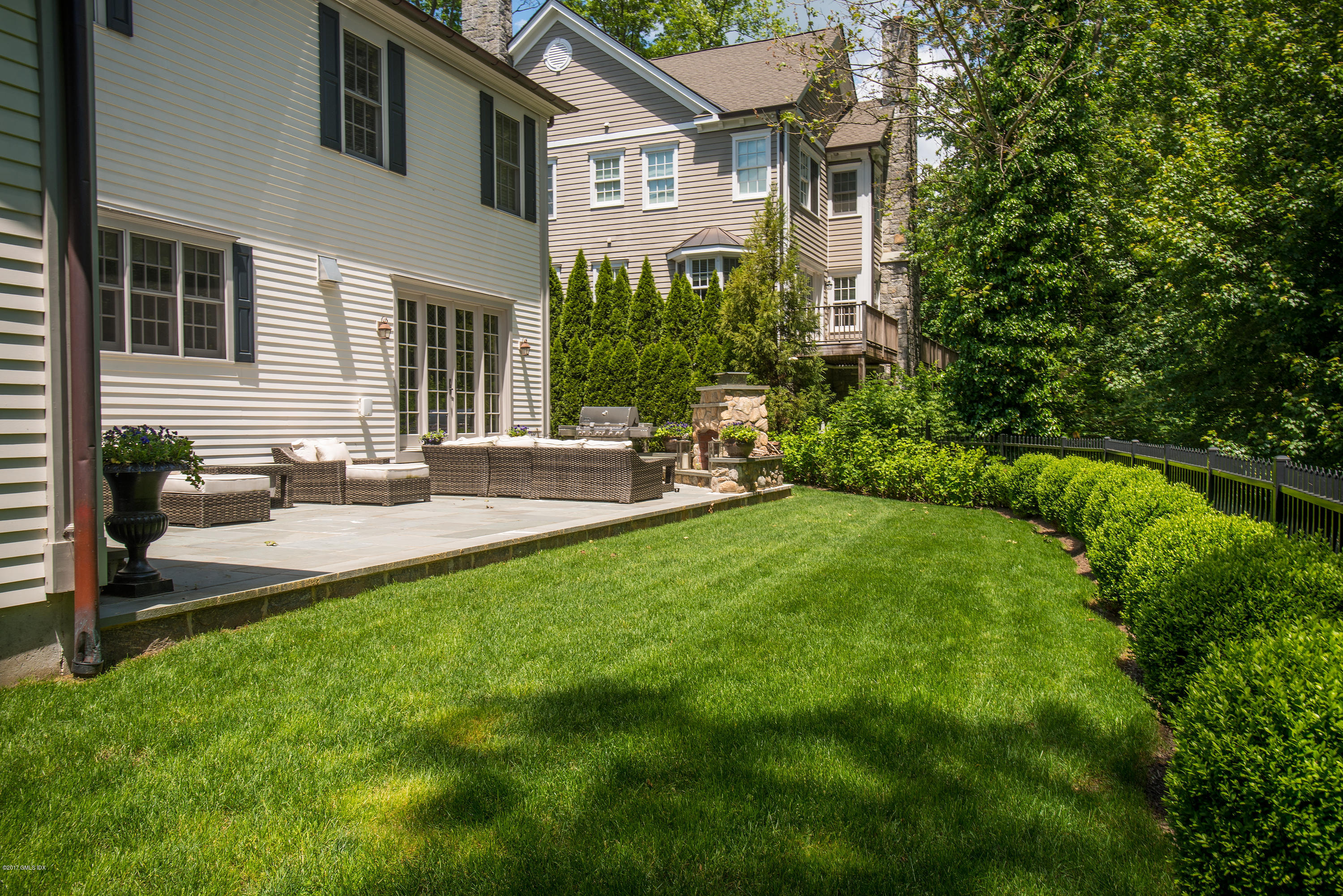 99 Overlook Drive Greenwich, CT 06830 - Photo 17 of 20 a view of a patio with chair and tables back yard of the house