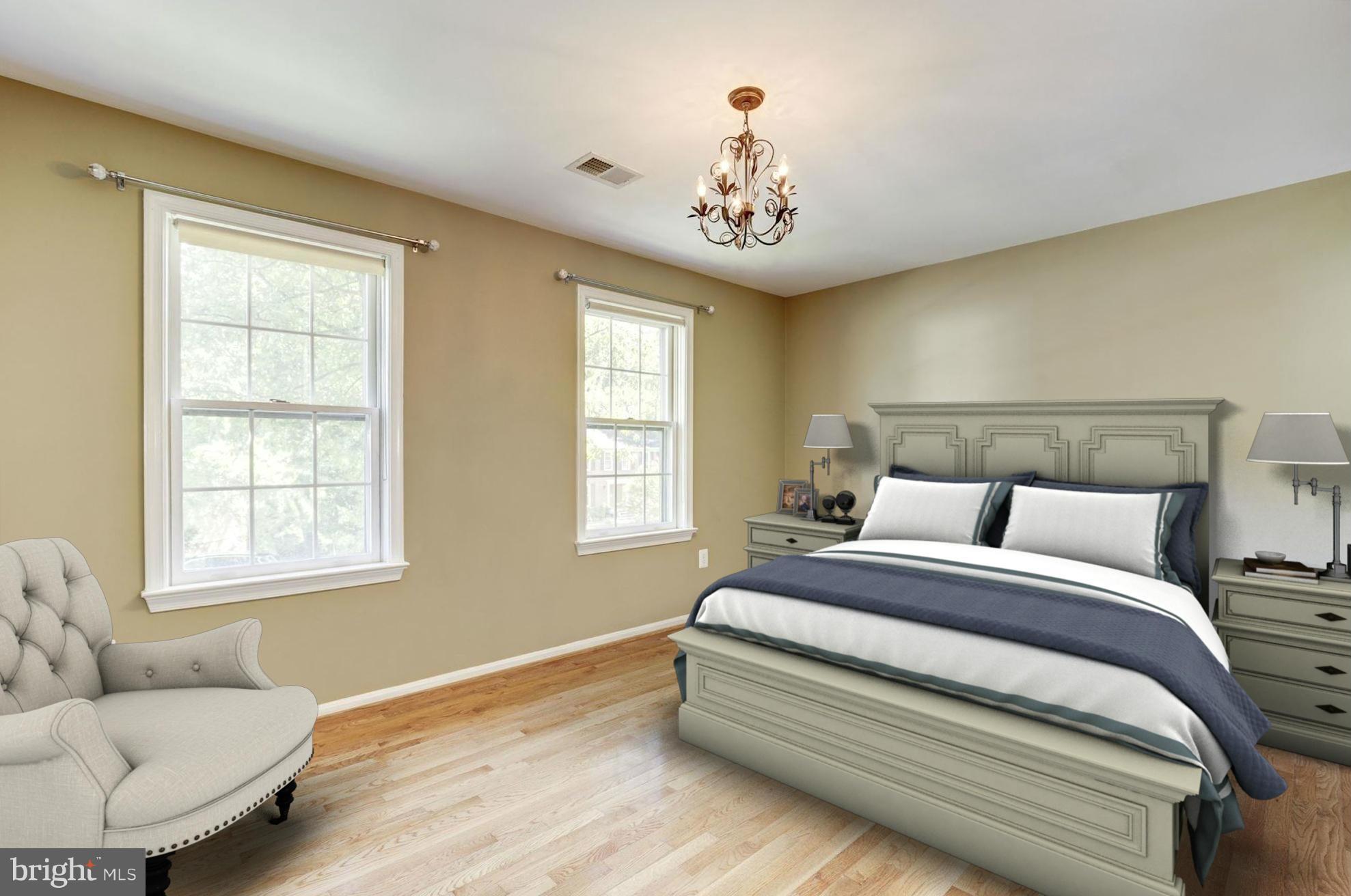 9019 Edgepark Road Vienna, VA 22182 - Photo 15 of 30 a spacious bedroom with a bed and a couch