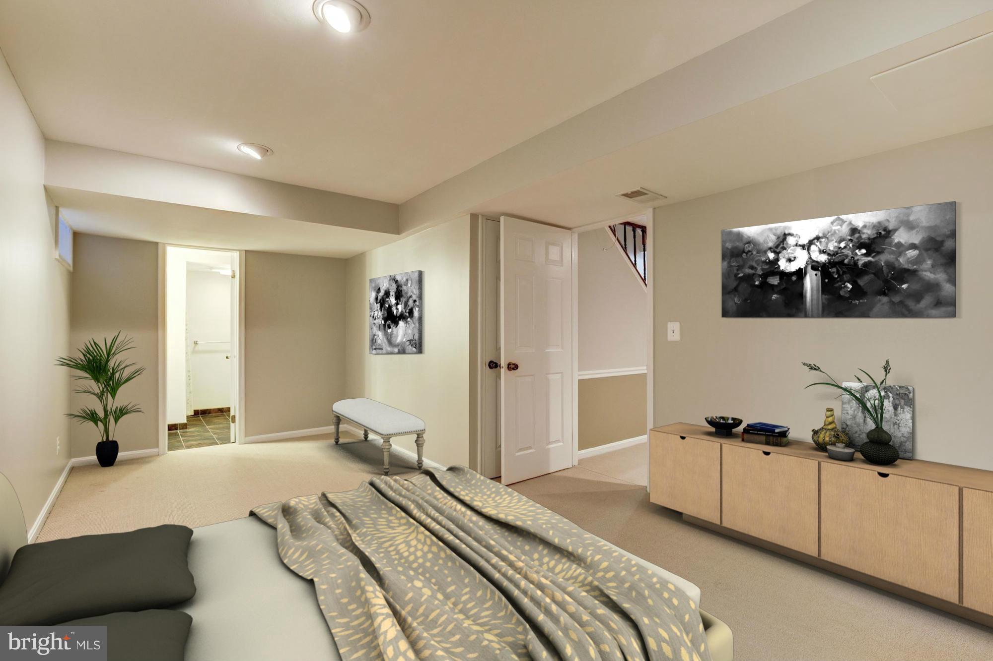 9019 Edgepark Road Vienna, VA 22182 - Photo 20 of 30 a spacious bedroom with a bed and a couch