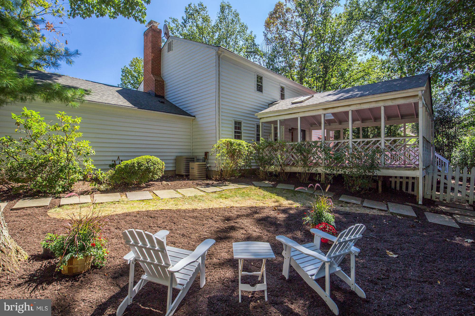9019 Edgepark Road Vienna, VA 22182 - Photo 24 of 30 a patio with table and chairs and potted plants