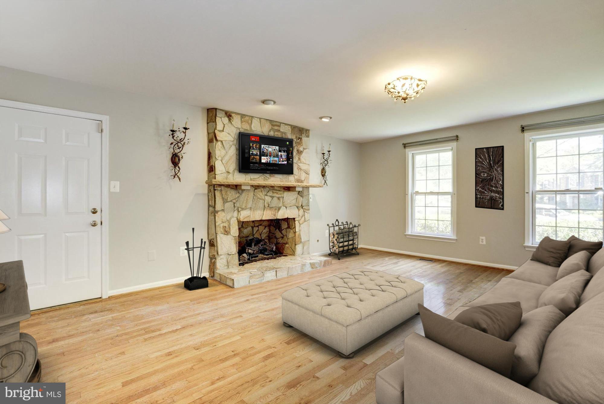 9019 Edgepark Road Vienna, VA 22182 - Photo 9 of 30 a living room with furniture and a fireplace