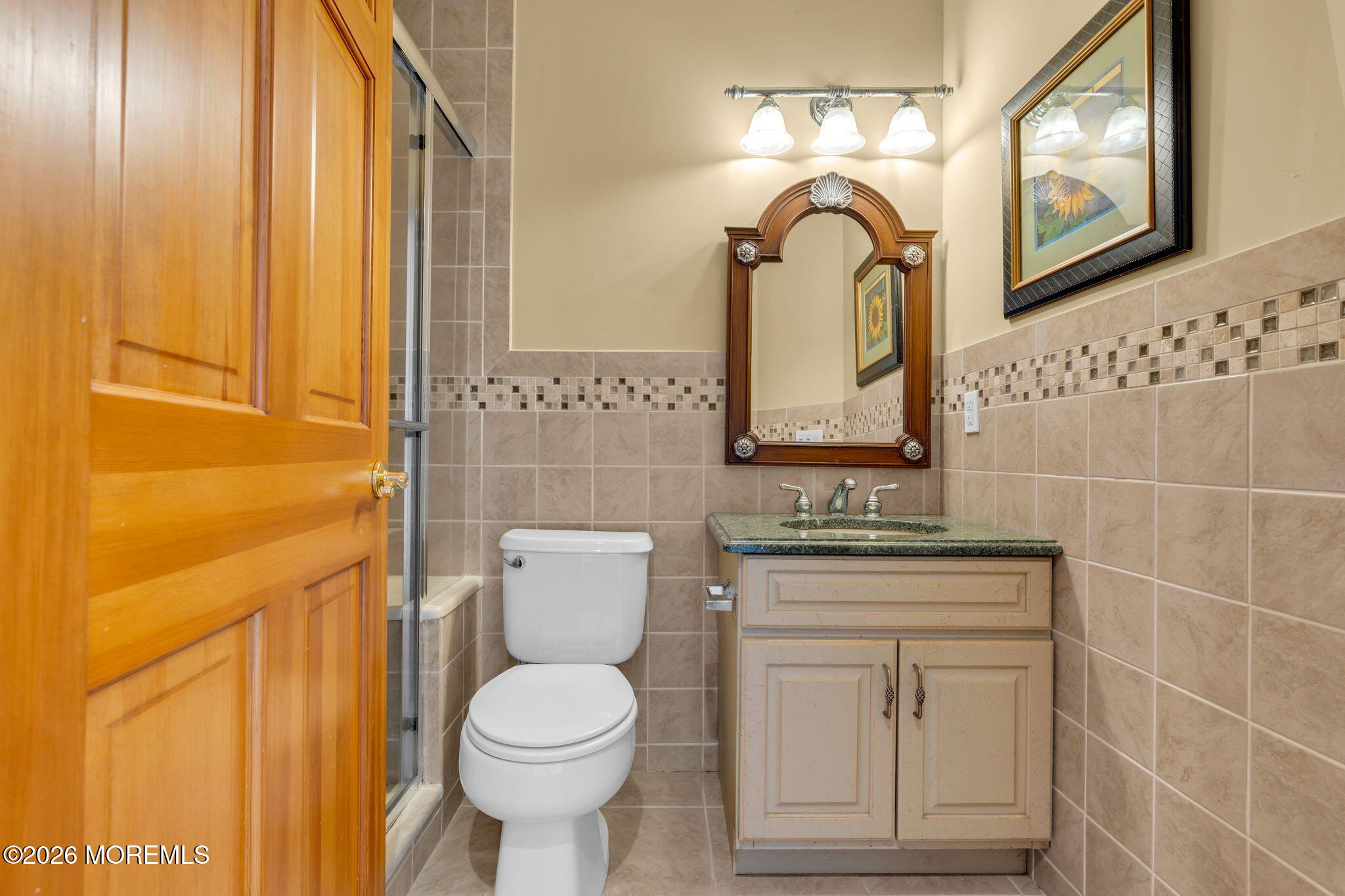 10 Waters Edge Brielle, NJ 08730 - Photo 27 of 50 a bathroom with a toilet sink and mirror