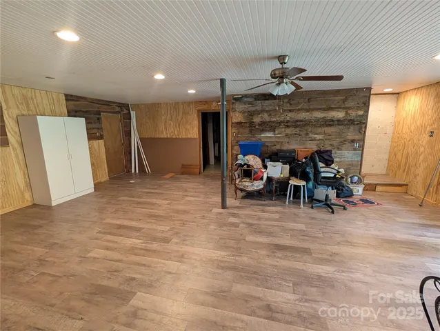 a view of a room with furniture and a fireplace