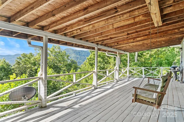 a view of a balcony with wooden floor