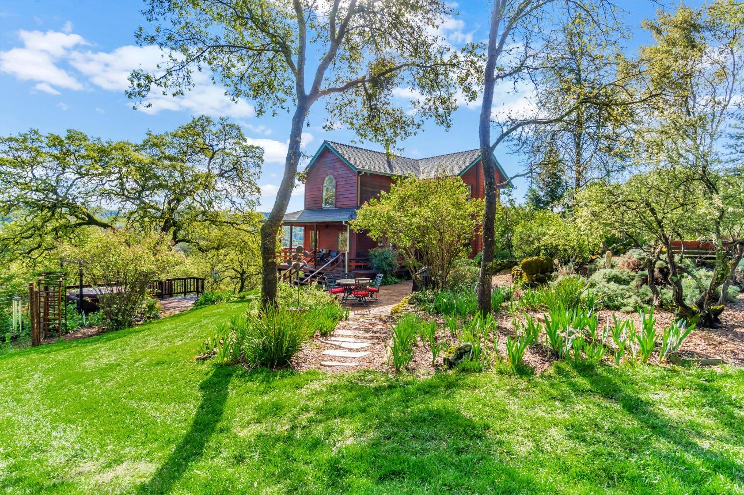 a view of a garden with a house