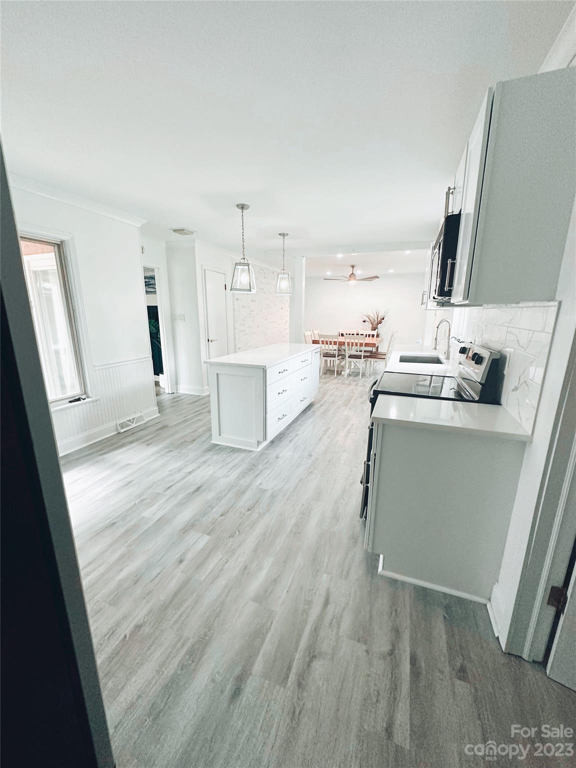 131 Mozelle Road Cherryville, NC 28021 - Photo 15 of 23 a room with a sink a washer and dryer