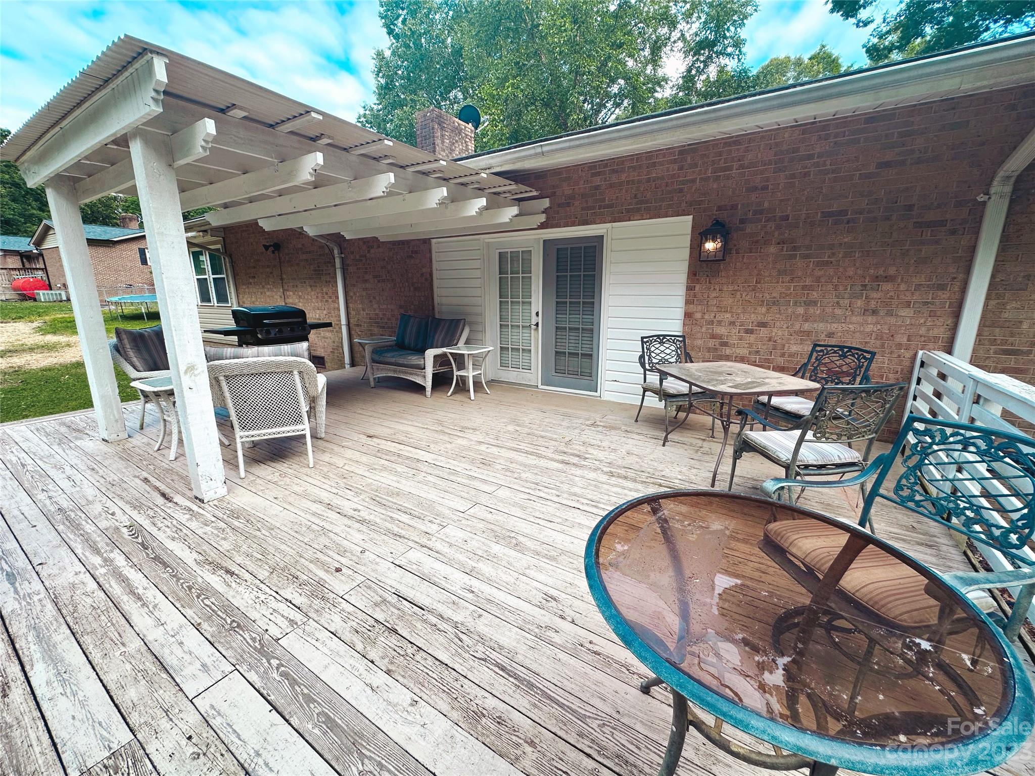 131 Mozelle Road Cherryville, NC 28021 - Photo 21 of 23 a view of a chairs and tables in patio with a barbeque