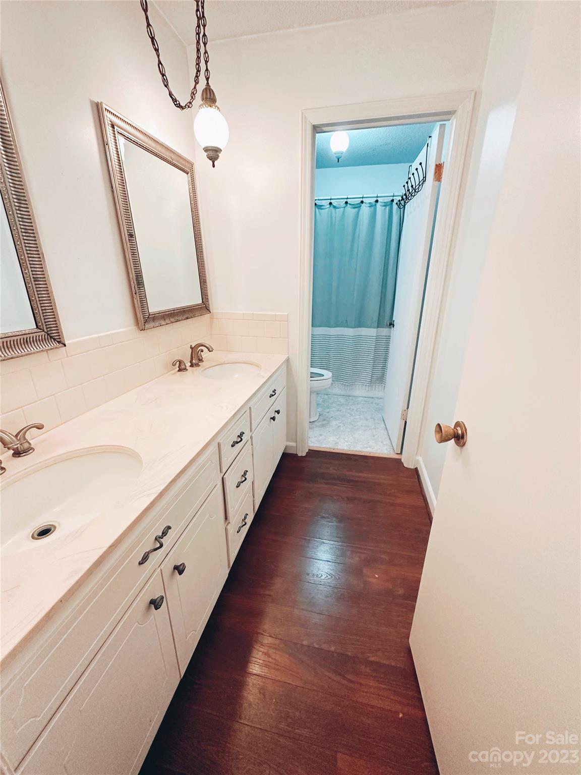 131 Mozelle Road Cherryville, NC 28021 - Photo 7 of 23 a bathroom with a double vanity sink and mirror with shower