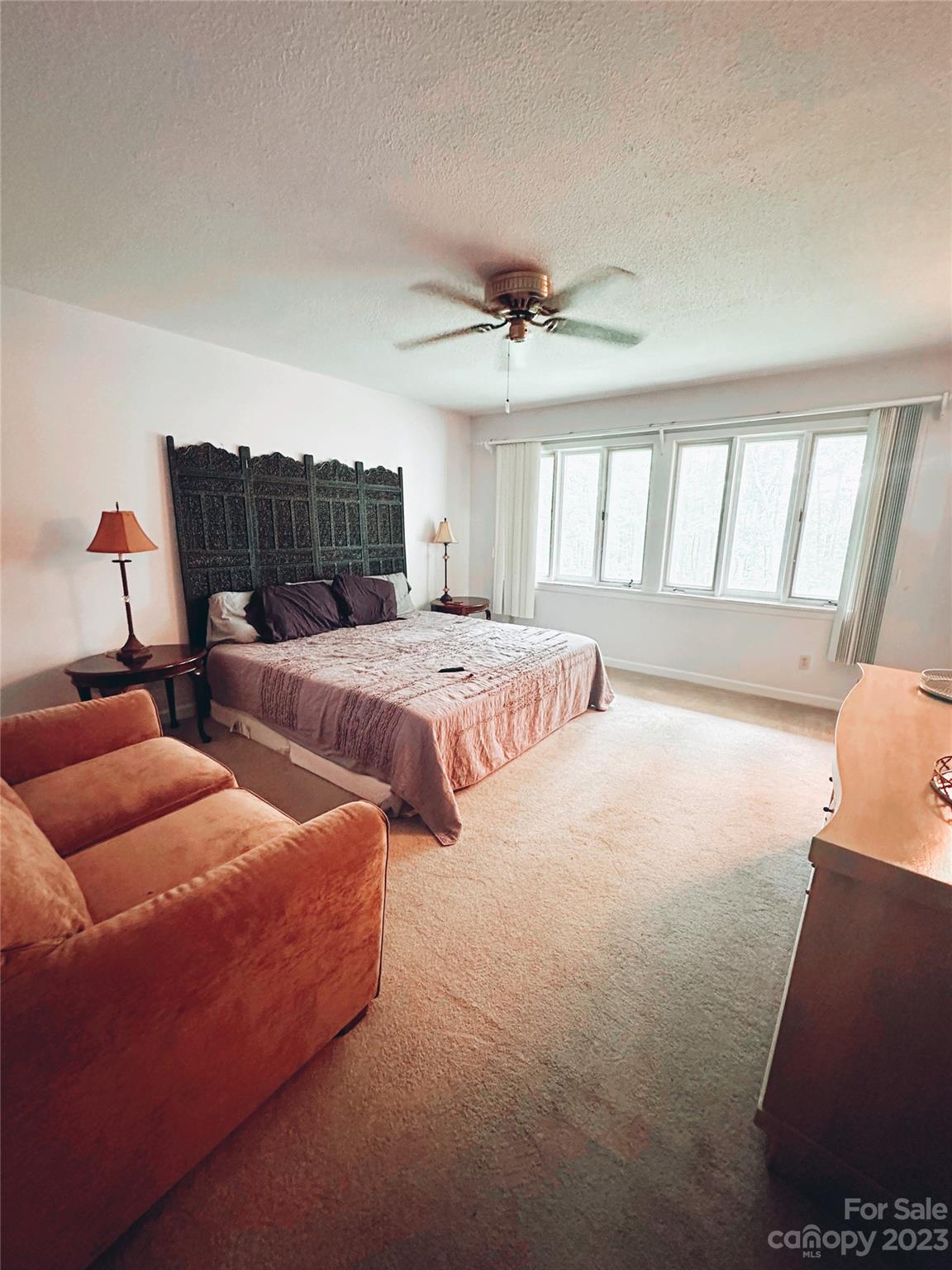 131 Mozelle Road Cherryville, NC 28021 - Photo 10 of 23 a bedroom with two beds and a chandelier