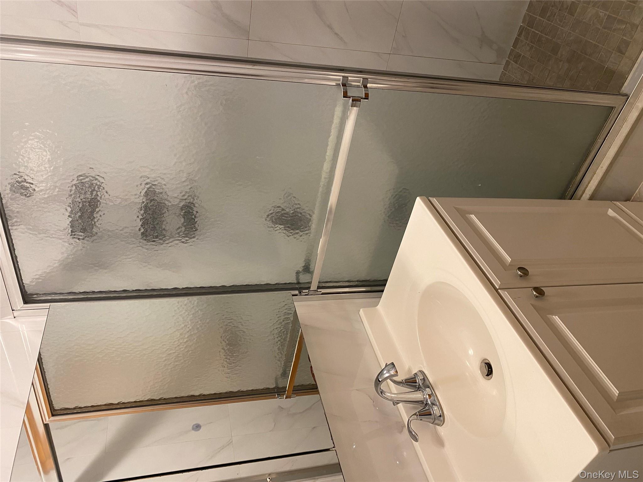 145-41 Willets Point Boulevard Queens, NY 11357 - Photo 8 of 8 a bathroom with a sink and mirror