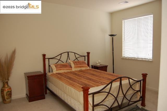 760 Waterville Drive Brentwood, CA 94513 - Photo 4 of 10 a bedroom with a bed a dresser and a window