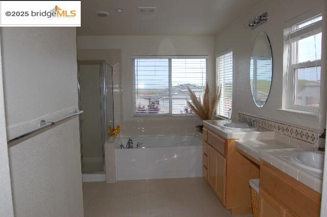 760 Waterville Drive Brentwood, CA 94513 - Photo 7 of 10 a bathroom with a granite countertop sink and a bathtub