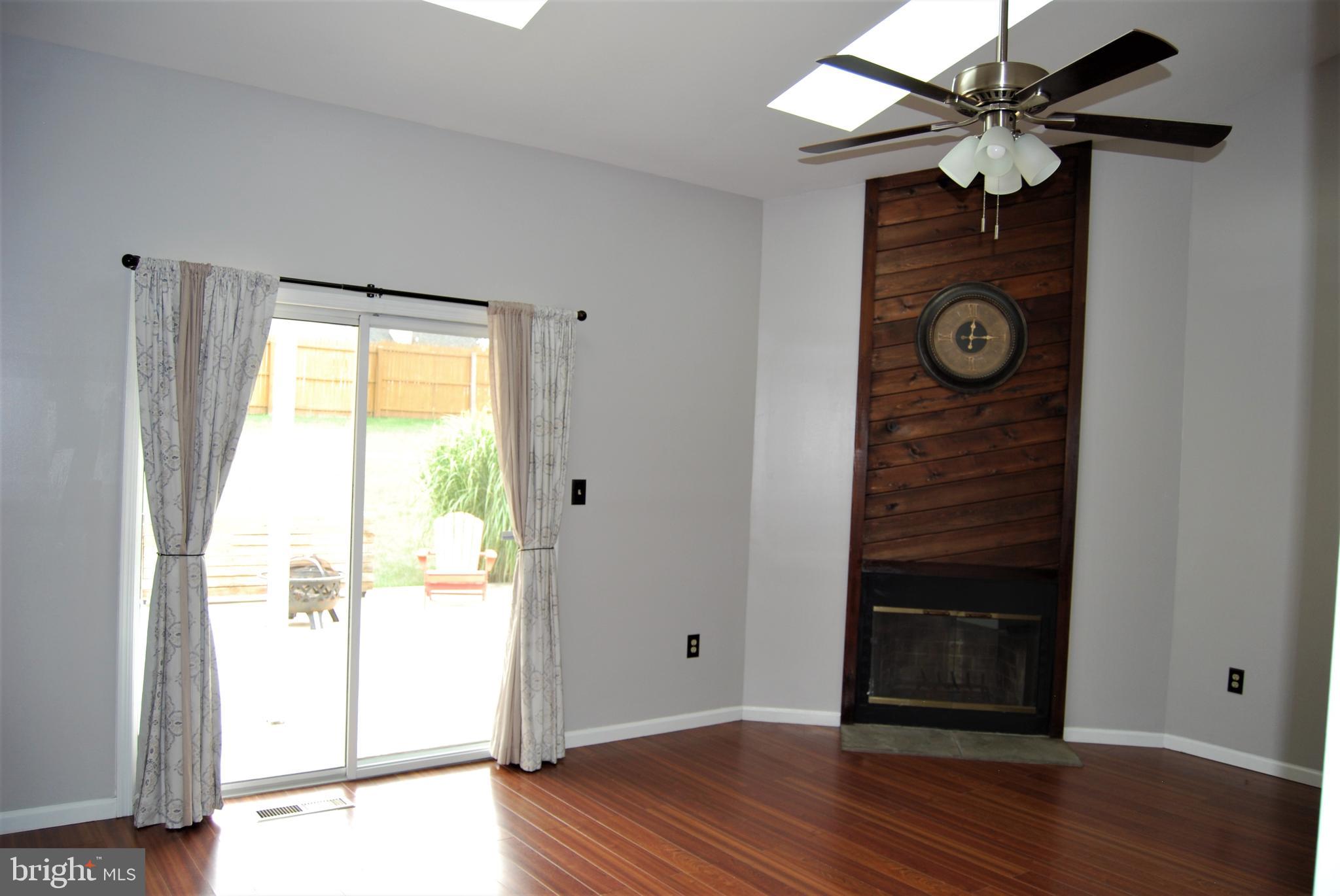1013 Rill Road Reading, PA 19606 - Photo 10 of 26 Livingroom, fireplace & rear patio exit